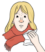 Erkältete Frau mit Schal und Taschentuch in der Hand